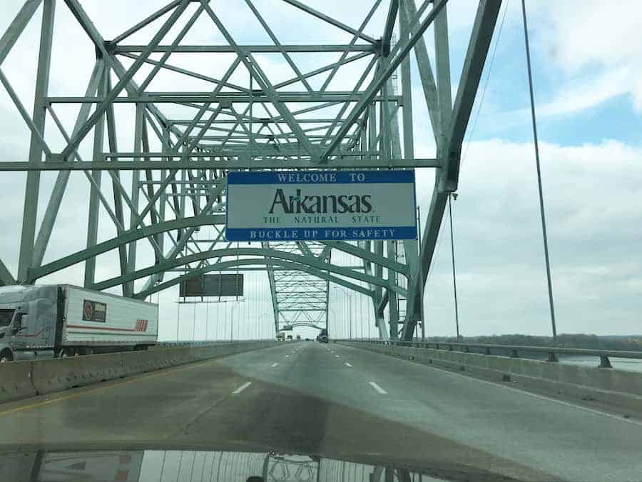 Welcome to Arkansas sign on bridge