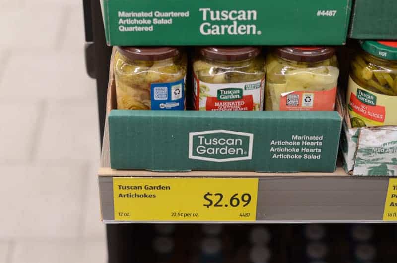 jars of artichokes on shelf at Aldi