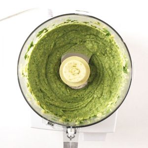 Overhead view of avocado dip mixed in food processor