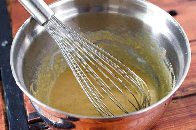 Side view of batter in stainless mixing bowl with whisk for Gluten Free Okonomiyaki (Japanese Cabbage Pancake)