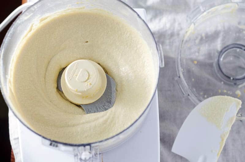 overhead view of food processor containing dairy free cheese sauce