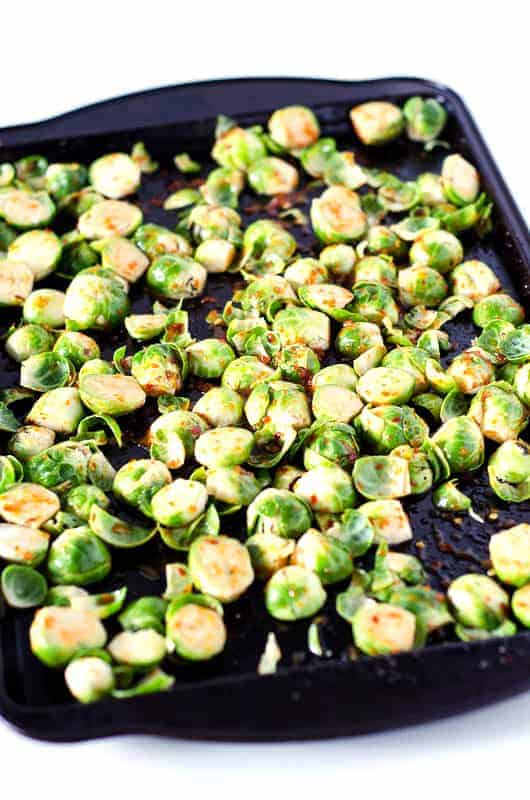 spicy brussel sprouts on pan before cooking