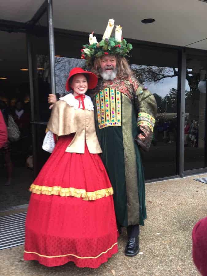 Man and woman in Christmas Carol costumes