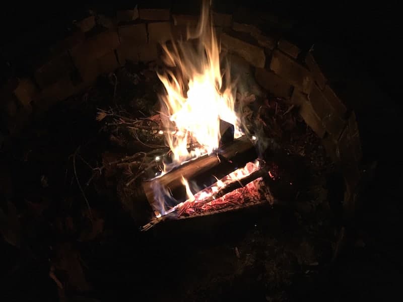 fire pit with fire burning in the dark