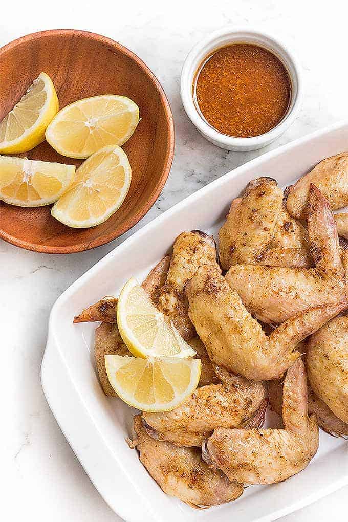 overhead view of platter of moroccan lemon wings