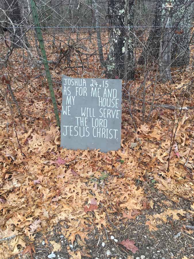 joshua bible verse sign in woods