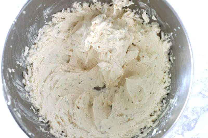 overhead view of lemon lavender frosting in mixing bowl