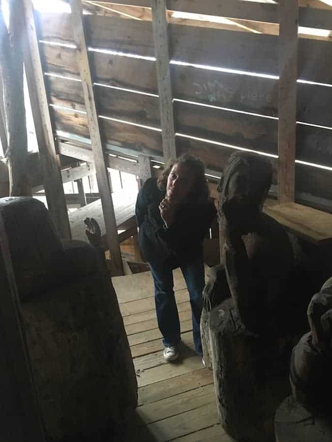 woman with statues inside The Ministers Treehouse