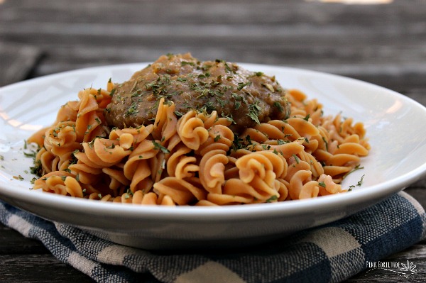 Plate of gluten free pasta topped with savory pumpkin sauce