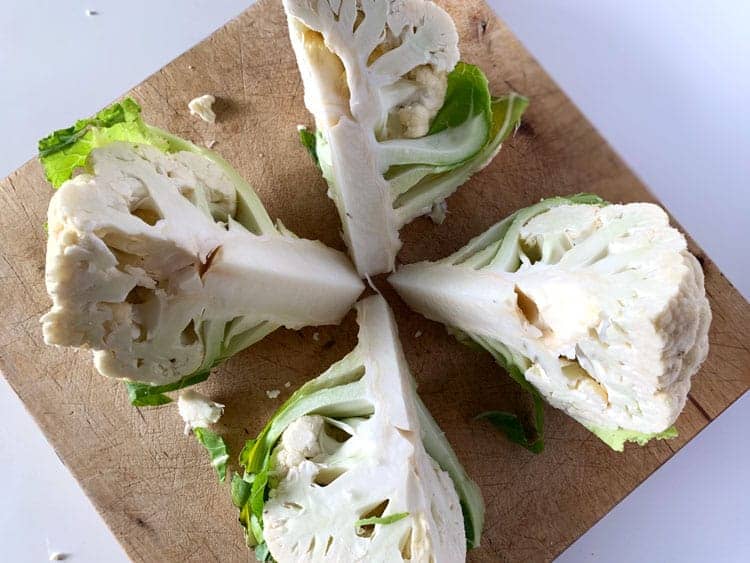 head of cauliflower cut into quarters