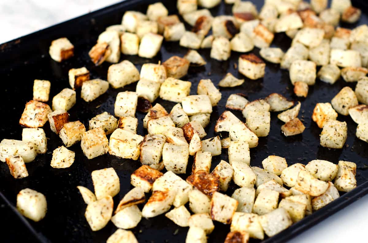 Roasted cubes of turnip on a baking sheet