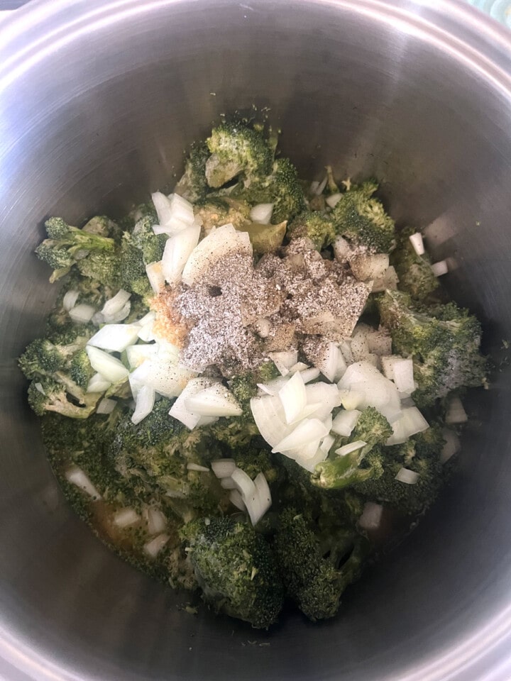 Broccoli onions and seasonings in stock pot for dairy free broccoli soup