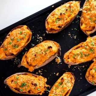 overhead view of baking sheet with twice baked sweet potatoes