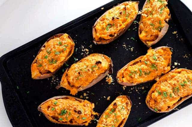 overhead view of baking sheet with savory twice baked sweet potatoes