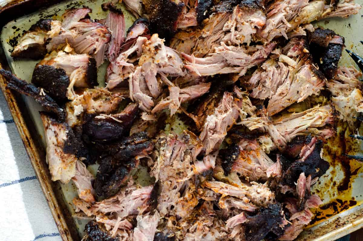 Pork butt shredded on sheet pan overhead view