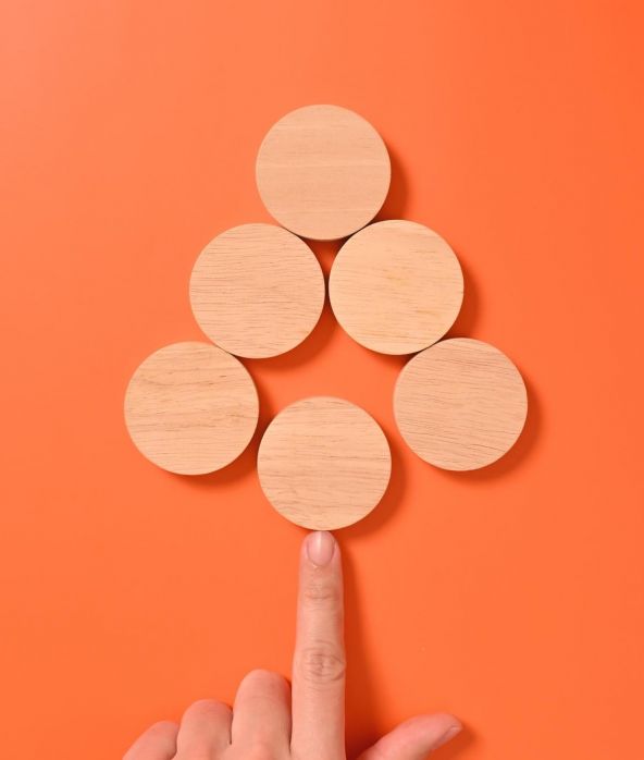 Wooden Discs on Orange Background