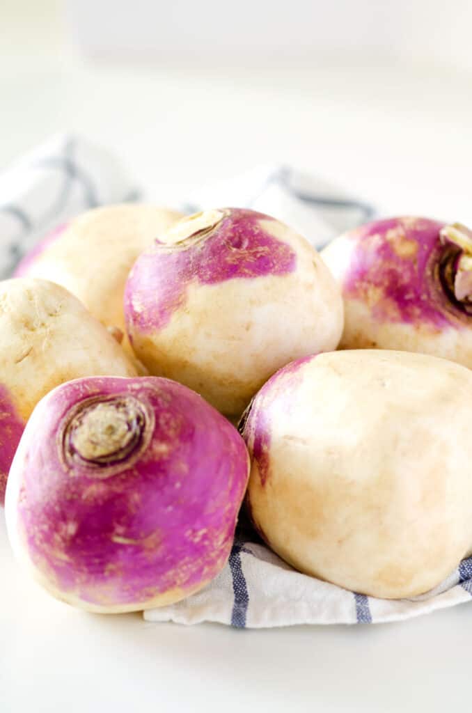 close up of raw turnips on a countertop